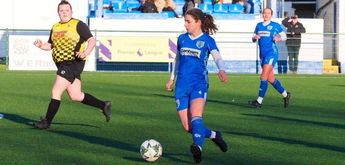 Tonbridge Angels Women FC player driving forward with the ball during a winter fixture at their home ground